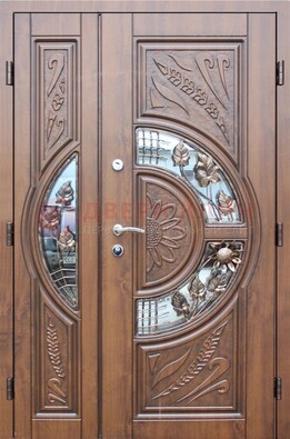 Уличная дверь в цвете Итальянский орех с виноритом и ковкой со стеклом ДВТ-147 в Лосино-Петровсом
